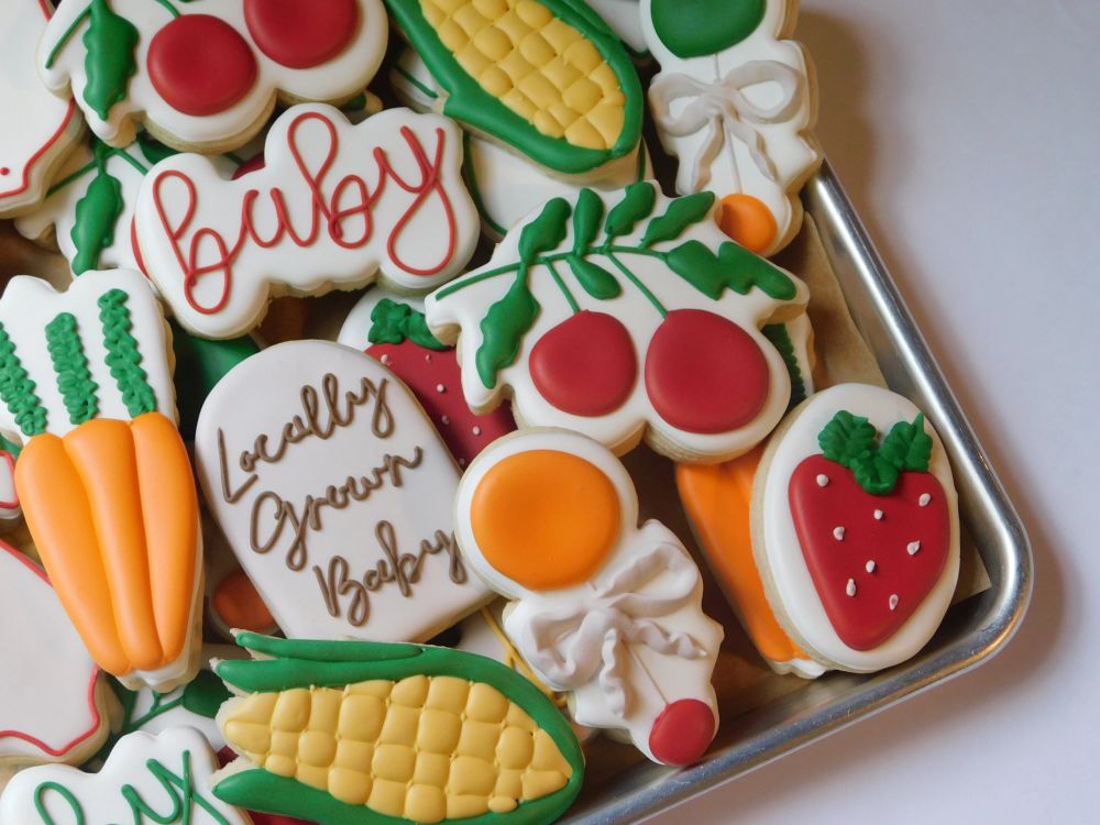 Farmers-market baby cookies shaped like corn, carrots, and strawberries