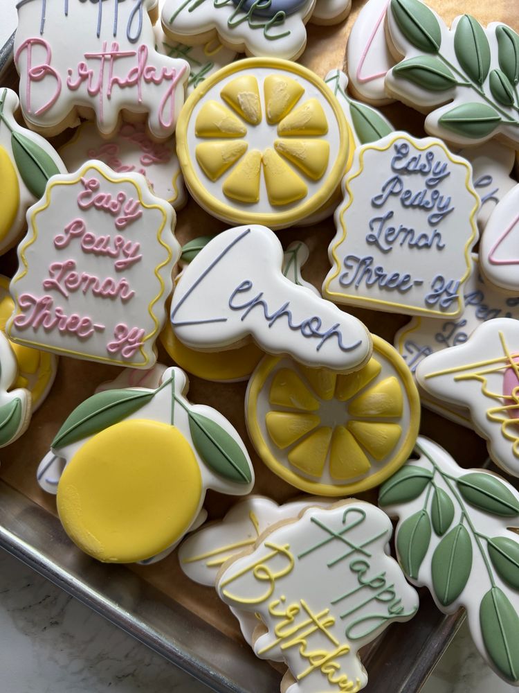 Lemon-slice birthday cookies with sage leaves and hand-lettered plaques