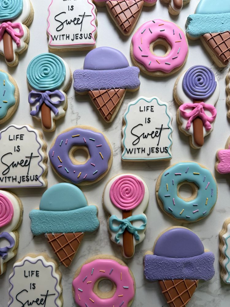 Pastel lollipop, donut, and ice-cream cookies with a sweet message