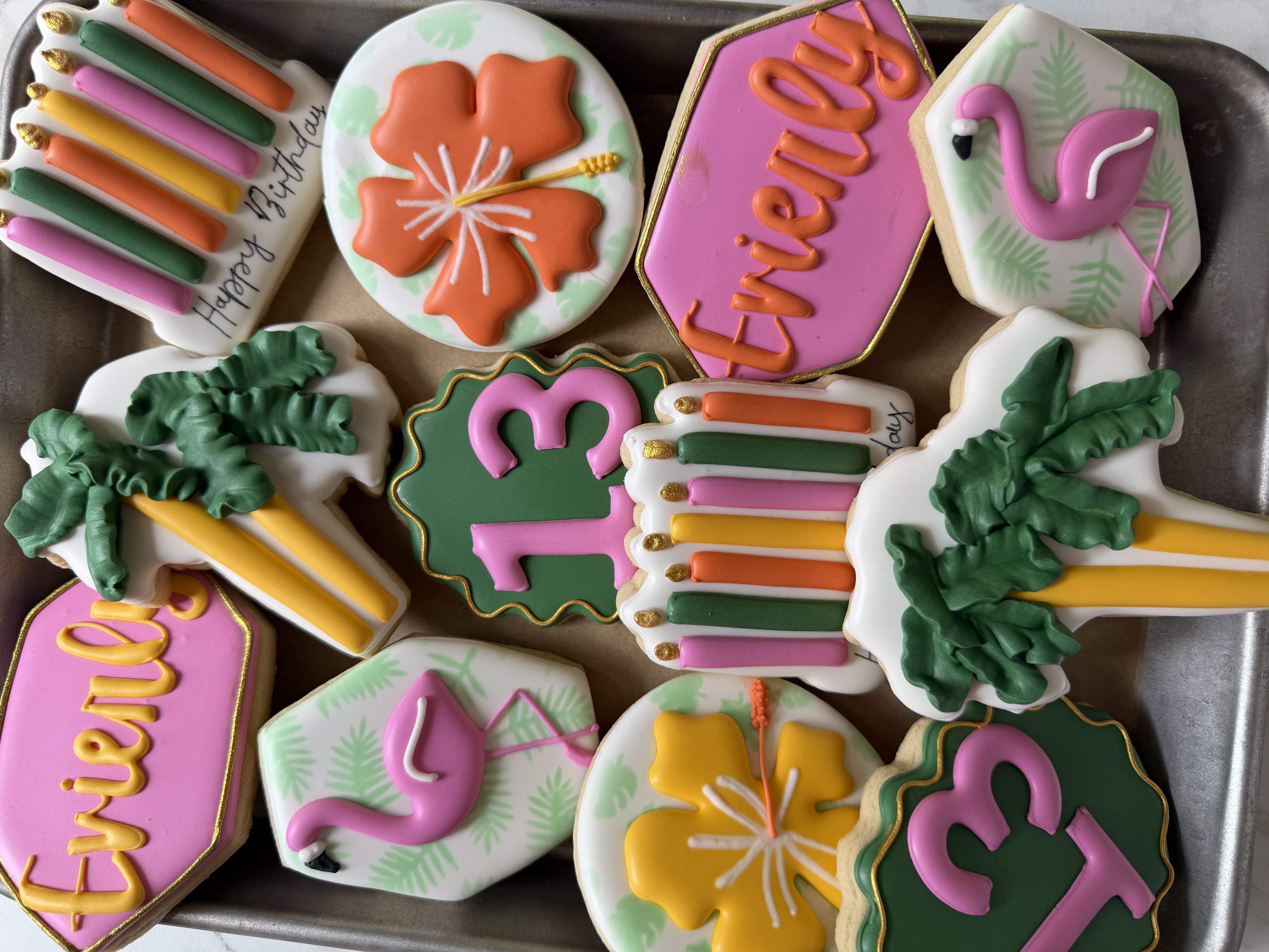 Tropical thirteenth-birthday cookies with flamingos, hibiscus, palms, and candles